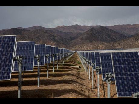 
Solar panels stand in the Quilapilún solar energy plant, a joint venture by Chile and China, in Colina, Chile on August 20, 2019.