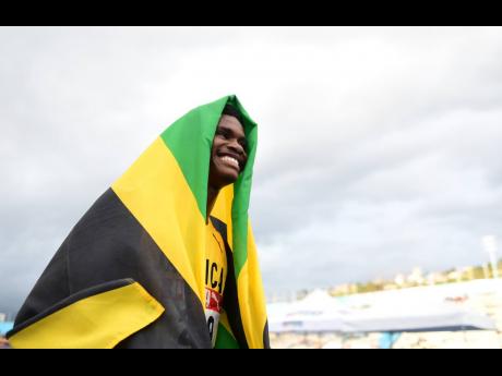 Jamaica’s J’Voughnn Blake celebrates his victory in the Under-20 Boys’ 800m finals at the 49th Carifta Games at the National Stadium in Kingston on April 18.