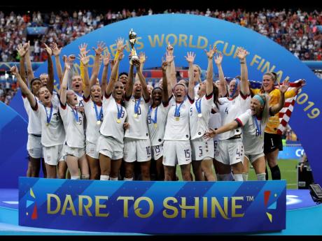 
The United States’ team celebrates with the trophy after winning the Women’s World Cup final soccer match against The Netherlands at the Stade de Lyon in Decines, outside Lyon, France, July 7, 2019.