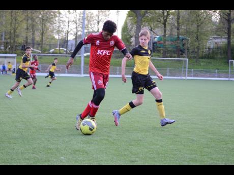 
Kingston Football Academy Striker and top scorer Kai Myles dribbles during a game between the academy’s U14 team and Roda JC recently. 
