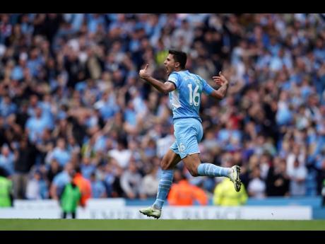 Manchester City's Rodrigo runs to celebrate after scoring his sides second goal during the English Premier League soccer match between Manchester City and Aston Villa at the Etihad Stadium in Manchester, England earlier today.