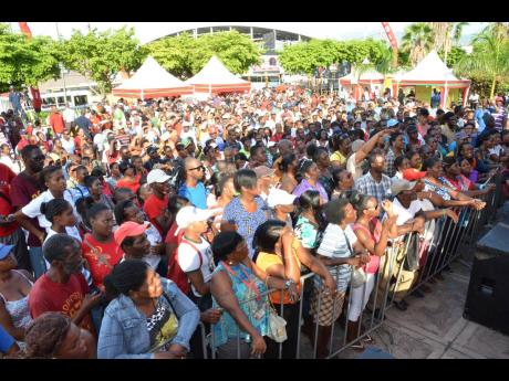 A crowd gathers while entertainers perform at a Digicel Christmas campaign launch at Nelson Mandela Park in 2013. 
