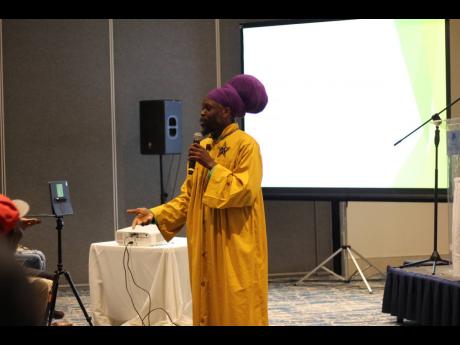 Priest Kailash Leonce from St Lucia gives a public lecture as part of the official launch of the Reclaiming Wellness and Reproductive Health Tour on Monday at The Jamaica Pegasus hotel. 