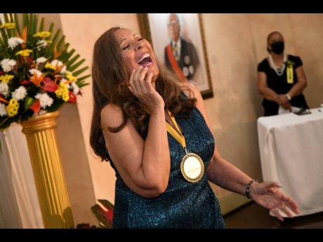Medal of Excellence awardee Dawn Marie James performs at the National Chorale of Jamaica ceremony, held on Sunday at King’s House. 