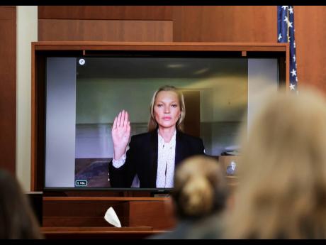 Model Kate Moss, a former girlfriend of actor Johnny Depp, testifies via video link at the Fairfax County Circuit Courthouse in Fairfax, Virginia, on Wednesday. 