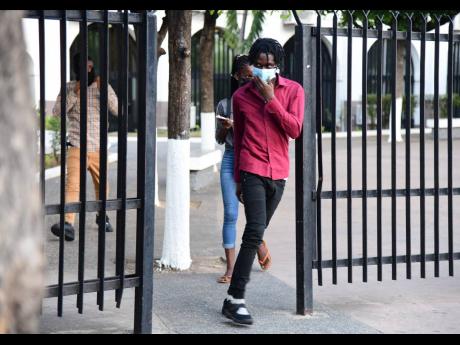 Roshane Williams, one of four alleged members of the Clansman-One Don Gang, departs the Home Circuit Court in Kingston on Thursday. The defence were successful in arguing that there was insufficient evidence. The trial will continue with the remaining 29 d
