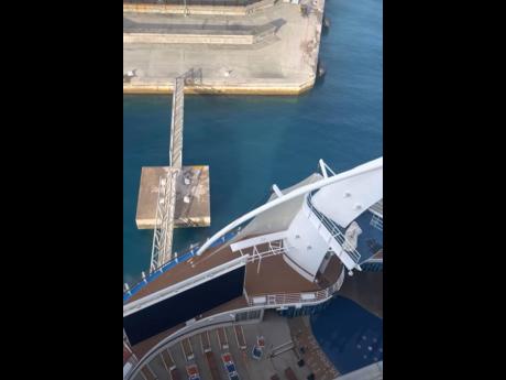 A screen grab from an amateur video posted to social media, reportedly showing the moment when the ‘Harmony of the Seas’ crashed into the Historic Falmouth cruise pier on Thursday.