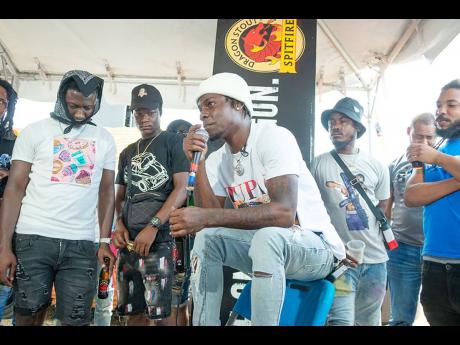 
Dancehall artiste Rytikal got comfortable as he spoke to the men gathered at Rocky Point Community Centre in Clarendon for the Dragon Stout ‘reasoning’ session on Labour Day.