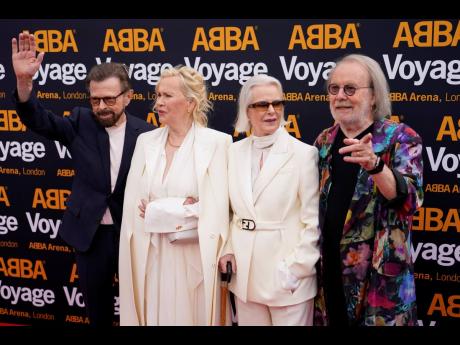 
Members of ABBA (from left) Bjorn Ulvaeus, Agnetha Faltskog, Anni-Frid Lyngstad and Benny Andersson arrive for the ‘ABBA Voyage’ concert. ABBA is releasing its first new music in four decades, along with a concert performance that will see the ‘Danc