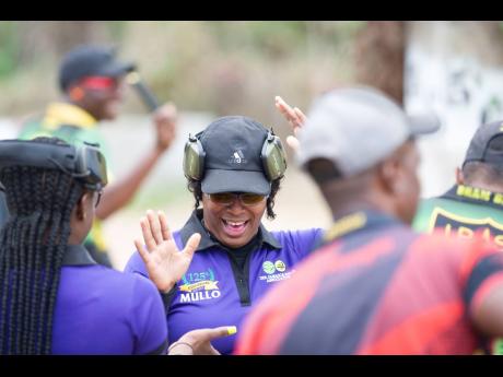 
Super Six captain Sasha-Gaye Mullings reacts to applause during the Carry Gun Nationals at the Jamaica Rifle Association on Saturday.