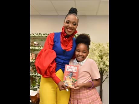 The woman of the hour – Dr Terri-Karelle Reid (left), and daughter, Naima-Kourtnae Reid, who Terri-Karelle thanked in her Acknowledgements for her curiosity, helpfulness and encouragement. 