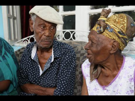 Leanora Commock Taylor of Western Park, Clarendon, flashes a smile at husband Zacchaeus Taylor. Approximately, 70 years ago, a young man strolled into the church, sat beside her, and kept staring in awe. Now 102, Commock Taylor says her love for Zacchaeus 