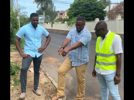 Heroy Clarke (centre), member of parliament for St James Central, surveys a section of Coke Avenue in Montego Bay, St James, where rehabilitation work was done over the weekend. Also pictured are Montego Bay Deputy Mayor Richard Vernon (left) and sub-contr