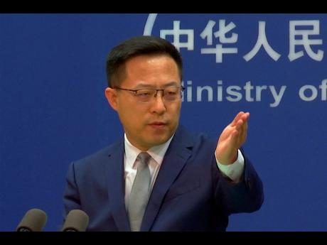
In this image made from video, Chinese foreign ministry spokesperson Zhao Lijian gestures during a media briefing at the Ministry of Foreign Affairs on Wednesday, April 6, in Beijing, China.