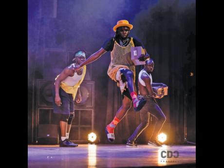 Sashi/Dogbed (center) in performance with Ghanaian dancers Yoofi Greene and E-Flex.