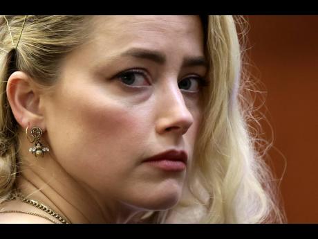 Actor Amber Heard waits before the verdict was read at the Fairfax County Circuit Courthouse in Fairfax, Virginia on Wednesday.
