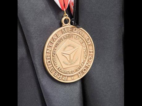 A closer look at the Presidential Medal of Honour presented to Patricia ‘Miss Pat’ Chin, co-founder and president of VP Records. Chin is the first to receive the honour.