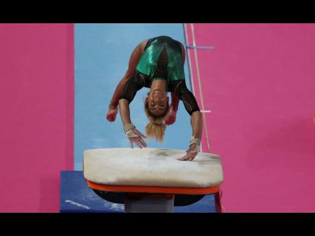 
Danusia Francis of Jamaica competes on vault in women’s individual all-around artistic gymnastics at the Pan American Games in Lima, Peru in July of 2019