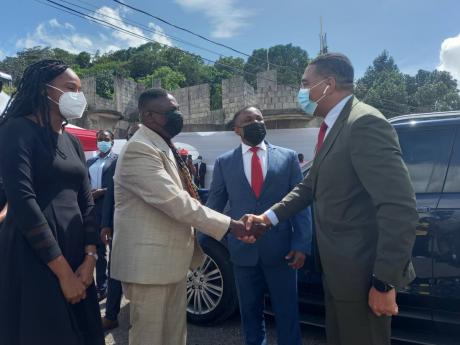 From left:  Member of Parliament for Manchester Central Rhoda Crawford, Chairman of K&T Development Kenneth Black, and senior partner at PFP Law Phillip Paulwell greet Prime Minister Andrew Holness at the groundbreaking ceremony of the K&T Development BPO 