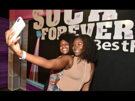 It’s a selfie moment for Kelsi Randall (left) and Jeneille Deans at Soca Forever.