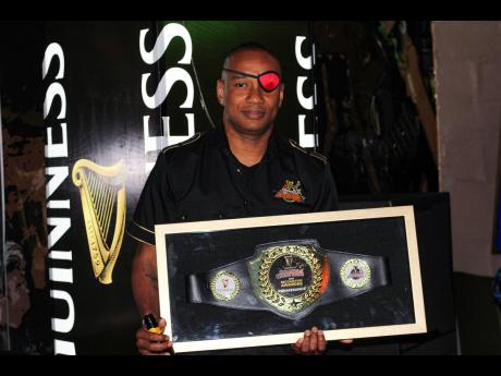 DJ Delano of Renaissance Disco proudly shows off the award bestowed on the sound system by Guinness.