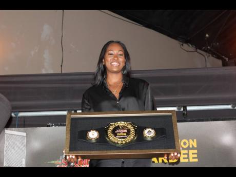 Chelsea Wauchope’s smile shines on stage as she steps forward to receive the Guinness Sounds of Greatness Recognition Award on behalf of her family’s sound system, Bodyguard.