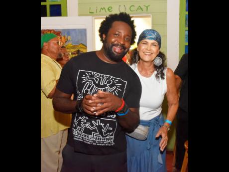 Booker Prize-winning author Marlon James, who is in Jamaica for the filming of the television series, ‘Get Millie Black’, which marks his screenwriting debut, is caught in a light moment with former Miss World Cindy Breakspeare. 
