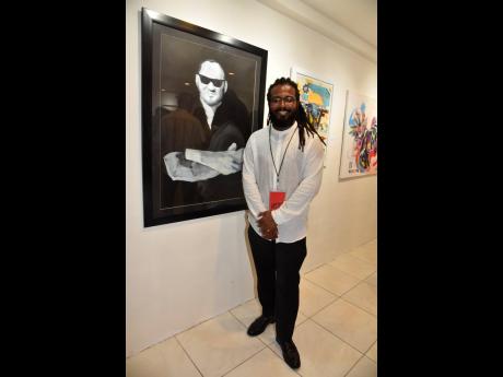 A proud Richard Nattoo stands in front of his artwork titled ‘Hilton’.