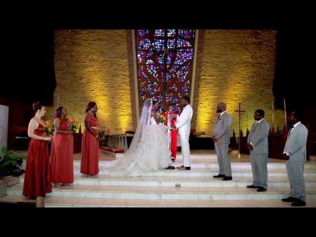 The Nwosus on their wedding day exchanging vows.