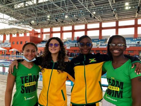 From left: The girls’ 13-14 4x50m medley team of Carolyn Levy-Powell, Leah Chin, Christanya Shirley and Zaviya Cameron, pose for a shot at the Pan American Swimmings Championships in Trinidad and Tobago at the weekend.