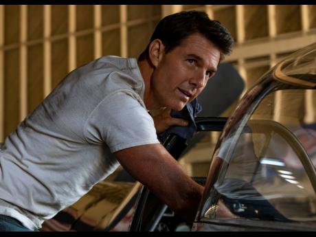 Tom Cruise portraying Captain Pete 'Maverick' Mitchell in a scene from 'Top Gun: Maverick'.  The widow and son of the man who wrote the 1983 article that inspired the original 'Top Gun' are suing Paramount Pictures over its sequel, 'Top Gun: Maverick'.