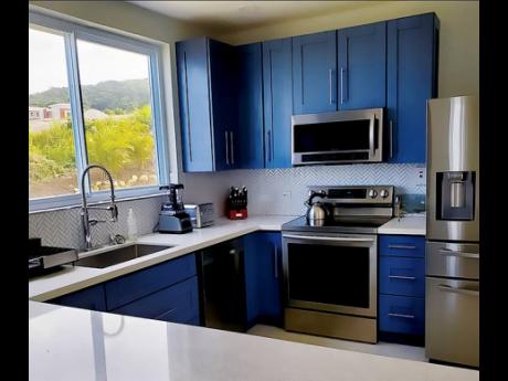 The kitchen imitates the colour of the surrounding seascape.