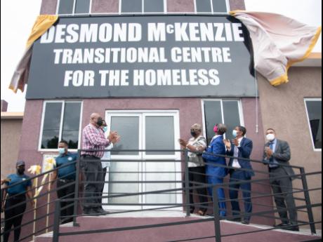 The unveiling of the sign of the Desmond McKenzie Transitional Centre for the Homeless on Friday, May 27. McKenzie announced that the homeless in St James will benefit from the Government’s New Social Housing Programme.