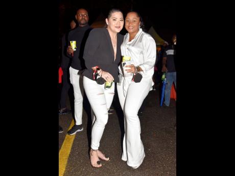 Kristalle Chin (left), head of sales, and Renee Reid, service manager, Digicel, mingled and had fun at the Digicel-sponsored Made in JamRoc.