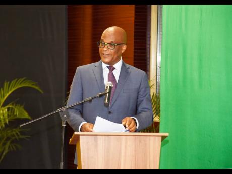  Leslie Campbell, minister of state, Ministry of Foreign Affairs and Foreign Trade, delivers the conference declaration at the biannual Diaspora Conference, held under the theme ‘Igniting a nation for greatness,’ at the Ministry of Foreign Affairs and 