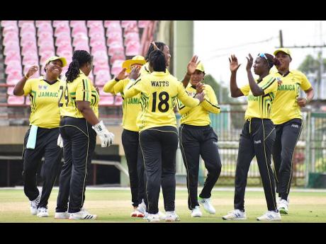 Jamaica’s women celebrate a wicket during their final T20 Blaze cricket game against the Leeward Islands women at the Guyana National Stadium on Tuesday.