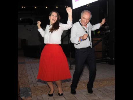 Dominican Republic Ambassador to Jamaica Angie Martínez Tejer (left) and Dr Samir Hamrouni, chief executive officer, World Free Zones Organization, were in a dancing mood. 