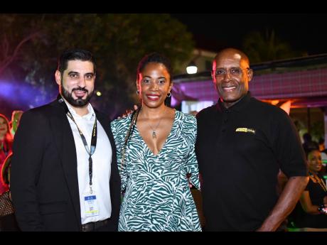 Minister of Industry, Investment and Commerce Aubyn Hill (right) shares lens with Hospiten’s Country Manager Samuel Afonso Diaz (left) and Commercial Director Chevaughne Miller at the Annual International Conference and Exhibition event, held at the Falm