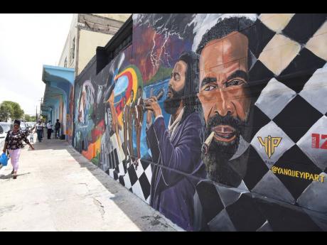 The new mural dedicated to fathers joins several other creative pieces brightening Church Street in downtown Kingston.