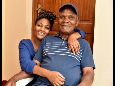 Swaby shares a moment with his granddaughter, Shanneil. 