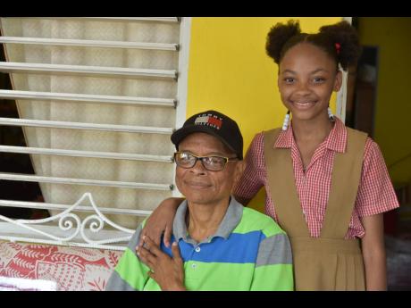 Derron ‘Brown Man’ Jarrett with 11-year-old daughter Dorraine