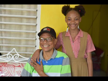 Derron ‘Brown Man’ Jarrett with 11-year-old daughter Dorraine
