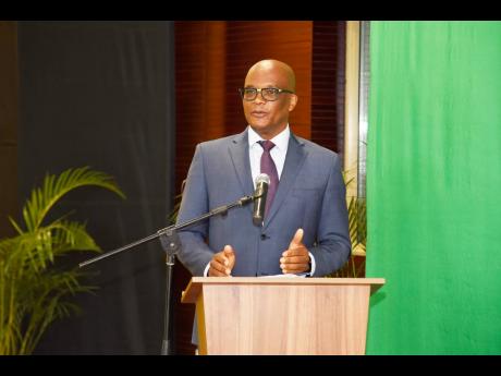 Leslie Campbell, minister of state, Ministry of Foreign Affairs and Foreign Trade, delivers the Conference declaration at the 2022 Diaspora Conference, under the theme 'Igniting a nation for Greatness,' at the Ministry of Foreign Affairs and Foreign Trade 