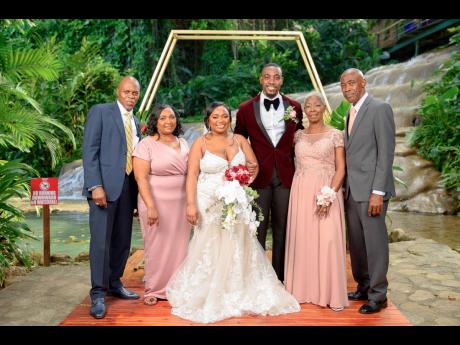 The bride and groom were happy to celebrate their matrimonial union in the presence of their parents. From left: Parents of the bride, Lincoln Johnson and Carol Wilson, the newly-weds; and parents of the groom, Paula and Everton Smith Sr. 