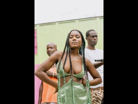 Sevana on set of her ‘Lowe Mi’ music video. In the background​ are her uncle Andrew Beckford (left) and brother Davin Blake. 