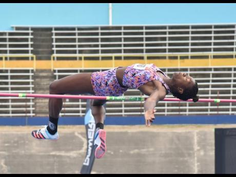 Kimberley Williamson clears the high jump bar during the women's event at the JAAA National Senior and Junior Championships inside the National Stadium earlier this evening.