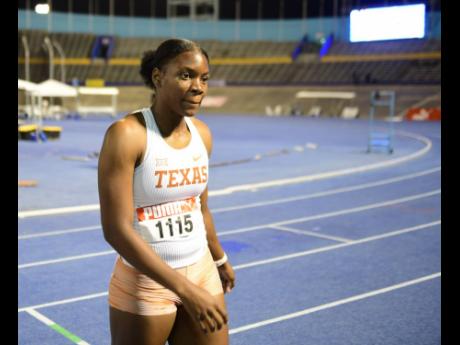 Kevona Davis of the Universiy of Texas moments after competing in the final section of the women's 100 metre heats at the JAAA National Senior and Junior Athletics Championsip inside the National Stadium last evening.