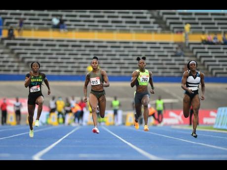Elaine Thompson Herah (second left) wins her semi-final heat at the JAAA National Senior and Junior Athletics Championships inside the National Stadium earlier this evening. Also in the frame are from left: Kemba Nelson, Shericka Jackson and Remona Burchel