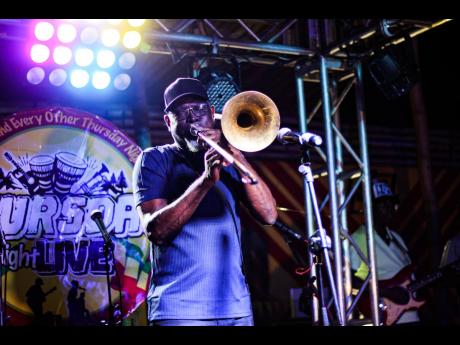 Romeo the Trombonist played with all his might last Thursday night live at Acoustic Inna Di City held at 8 Rivaz at The Cove. 