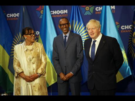 From left: Commonwealth Secretary General Patricia Scotland, Rwanda’s President Paul Kagame, and Britain’s Prime Minister Boris Johnson pose for a group photograph at the Commonwealth Heads of Government Meeting (CHOGM) in Kigali, Rwanda.